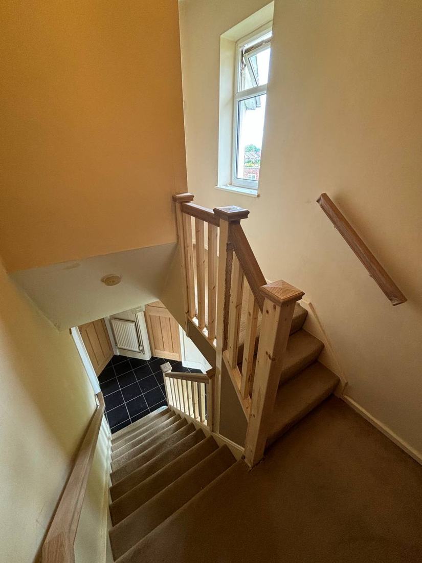 New staircase balustrade with newel posts on a turning stair