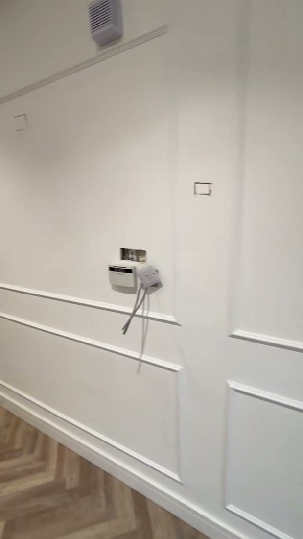 Painted shaker-style wall panelling in a hallway