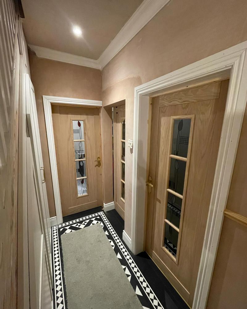 Hallway with glazed oak doors and Victorian floor tiles