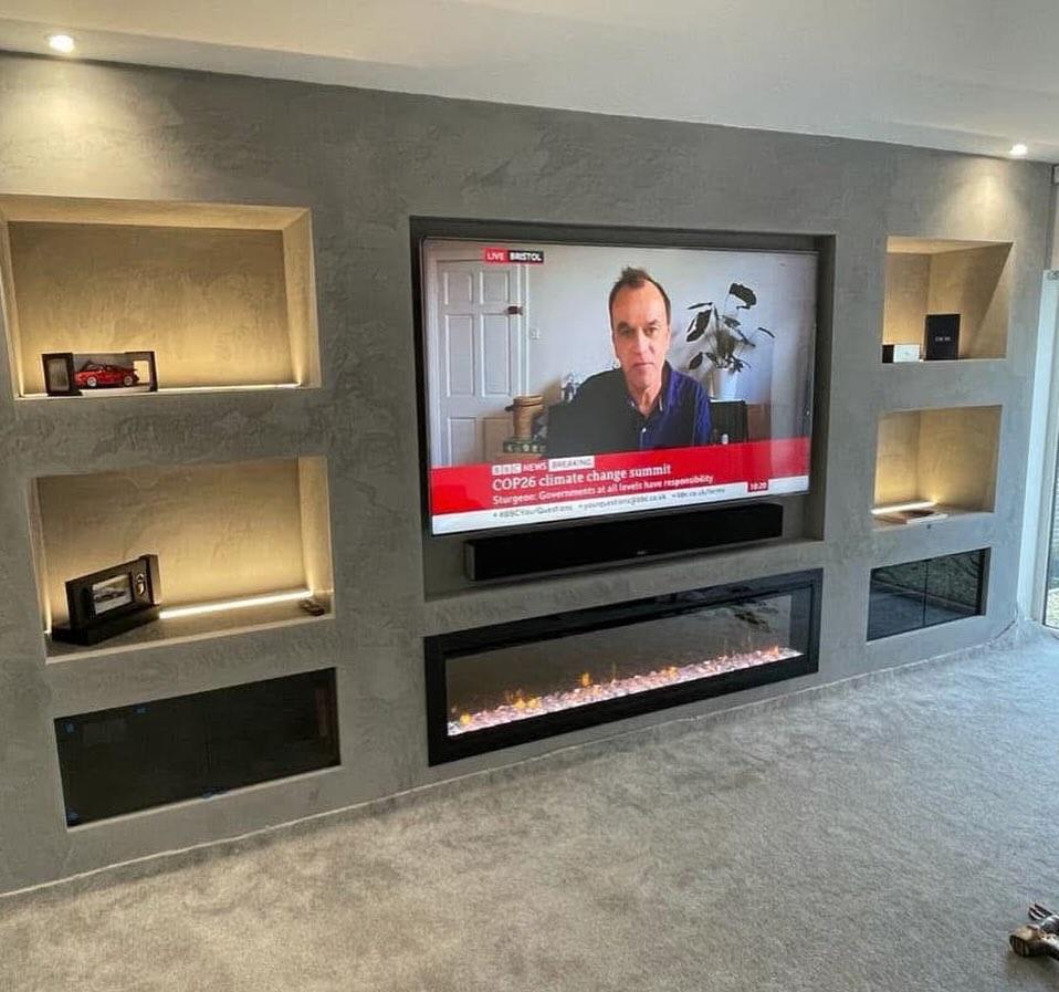 Media wall finished in venetian plaster with lit alcoves